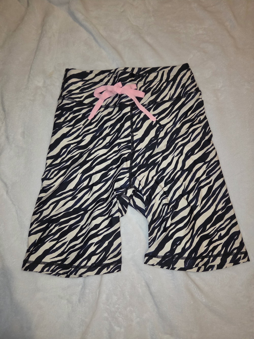 The Upside Black and White Zebra Print Bike Shorts with Pink Bow